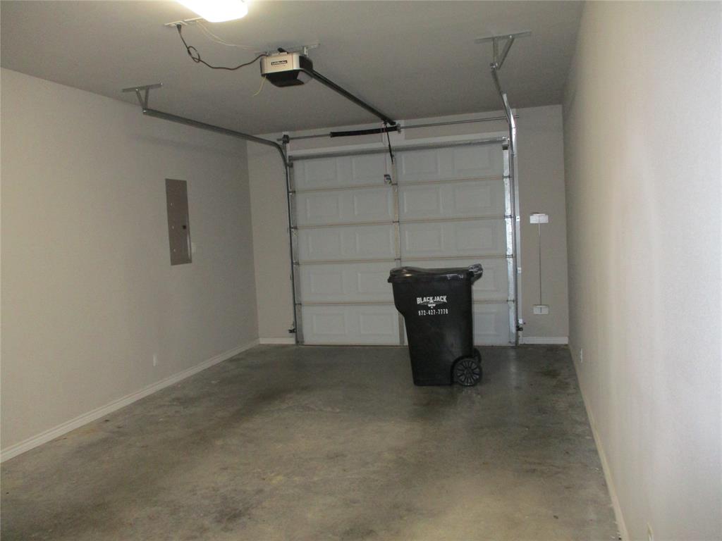 207 Mill Street Emory, TX 75440 - Photo 9 of 34 a view of a storage & utility room with racks on the wall