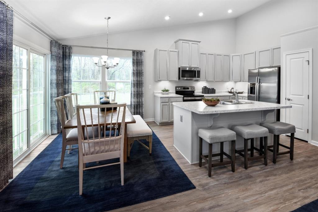 200 Mary Lane Coraopolis, PA 15108 - Photo 3 of 14 a dining room with stainless steel appliances furniture wooden floor and a rug