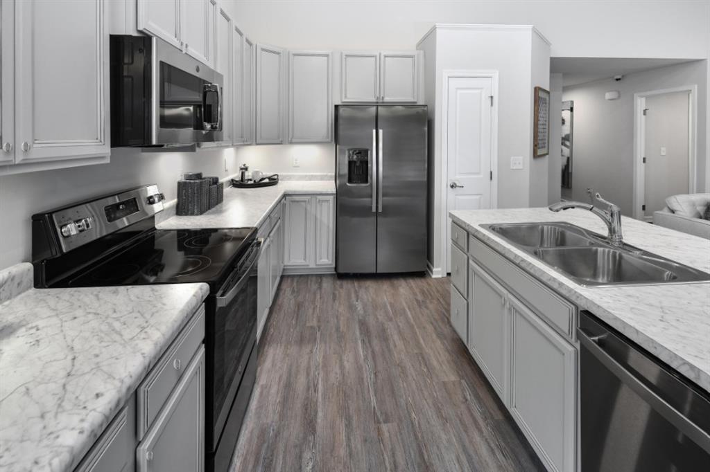 200 Mary Lane Coraopolis, PA 15108 - Photo 4 of 14 a kitchen with a sink stove and refrigerator