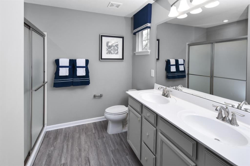 200 Mary Lane Coraopolis, PA 15108 - Photo 10 of 14 a bathroom with a toilet a sink and mirror