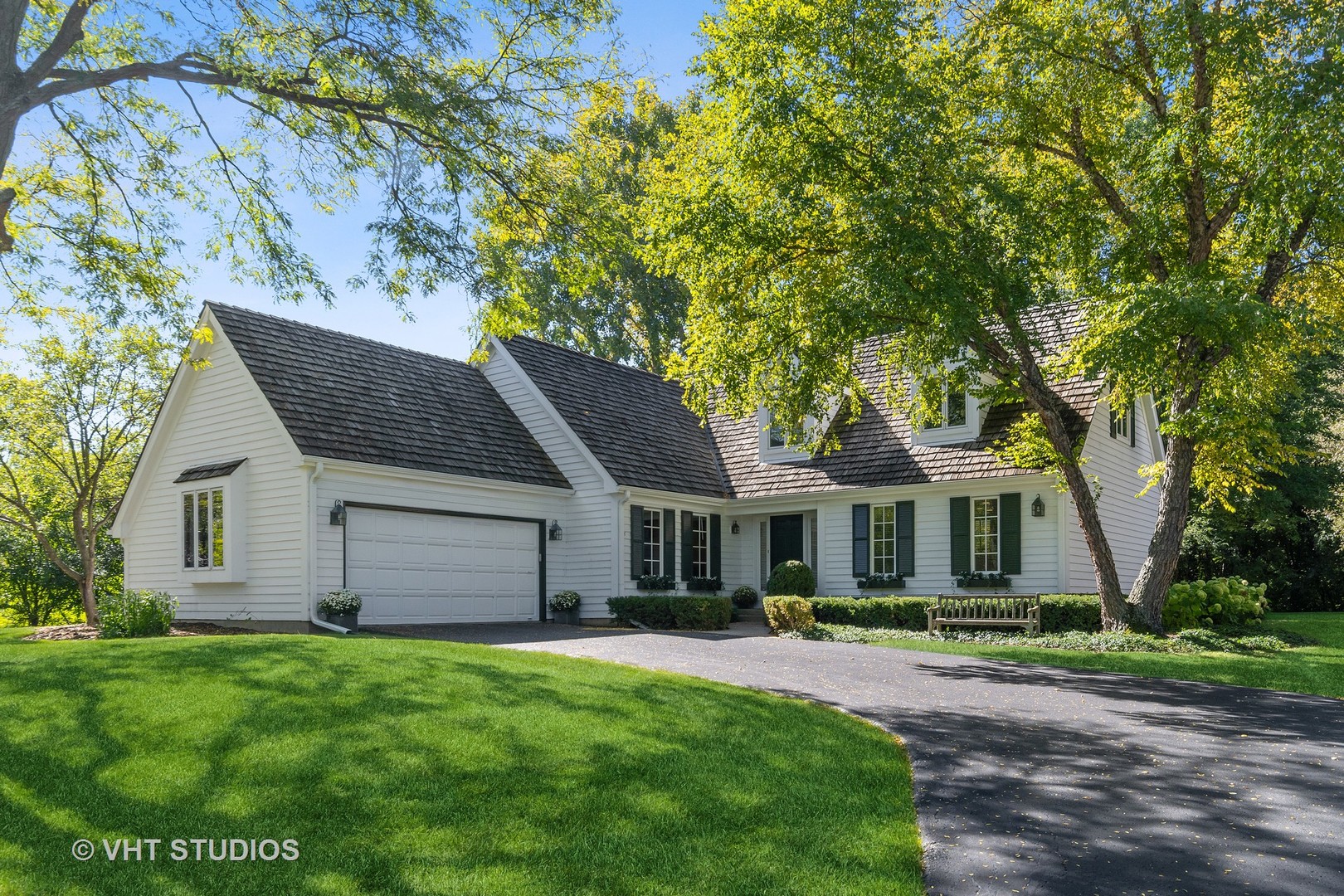 540 Buena Road Lake Forest, IL 60045 - Photo 2 of 37 a front view of a house with a garden