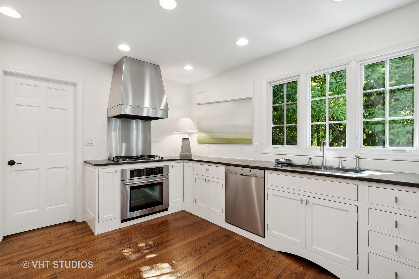 540 Buena Road Lake Forest, IL 60045 - Photo 21 of 37 a kitchen with a sink stove and cabinets