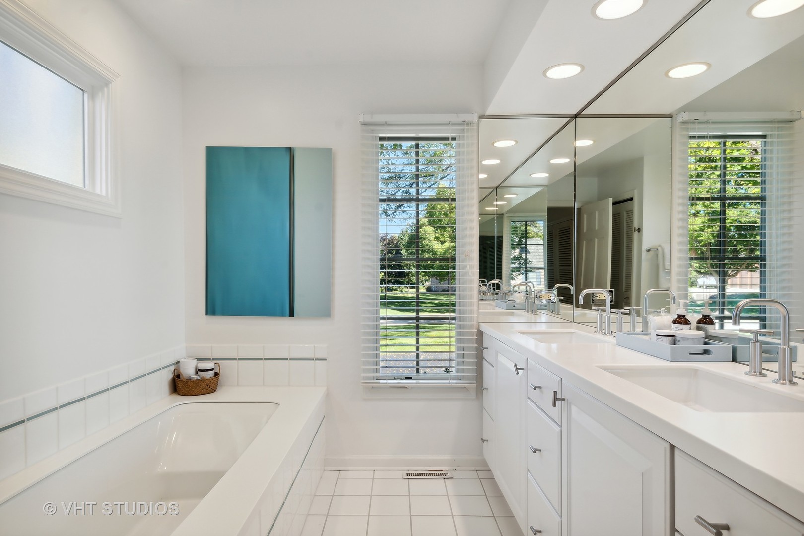 540 Buena Road Lake Forest, IL 60045 - Photo 29 of 37 a bathroom with a tub a sink and a large mirror
