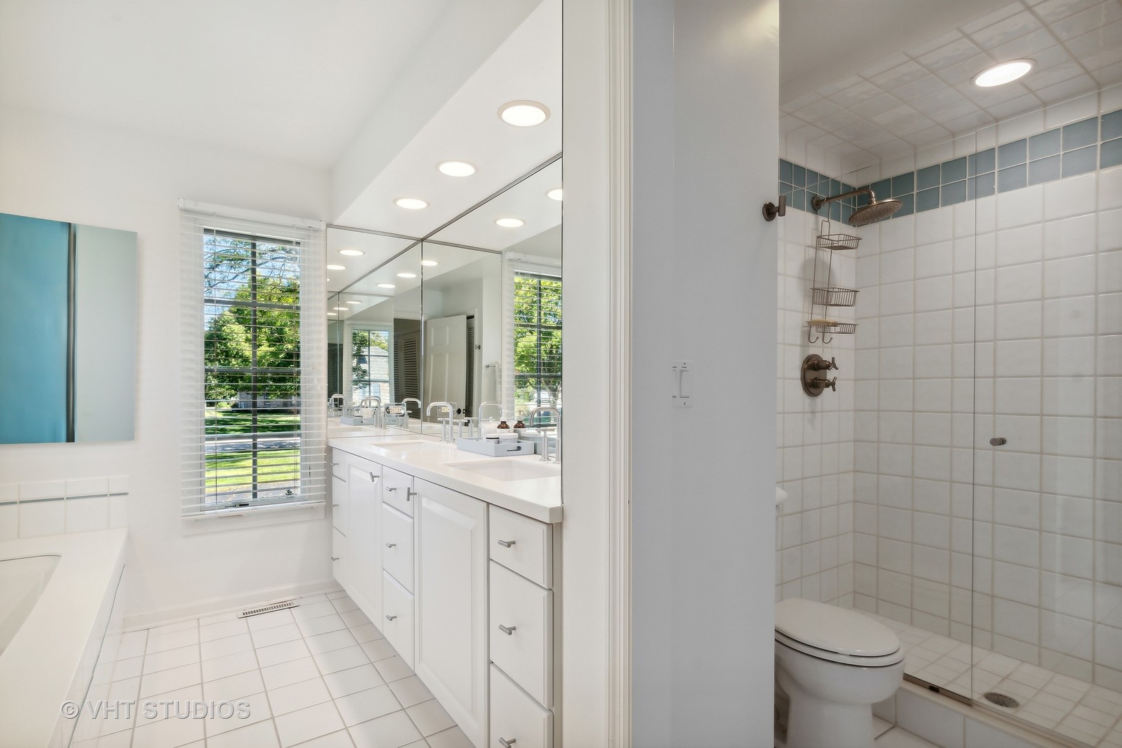 540 Buena Road Lake Forest, IL 60045 - Photo 30 of 37 a bathroom with a granite countertop sink a toilet a mirror and shower