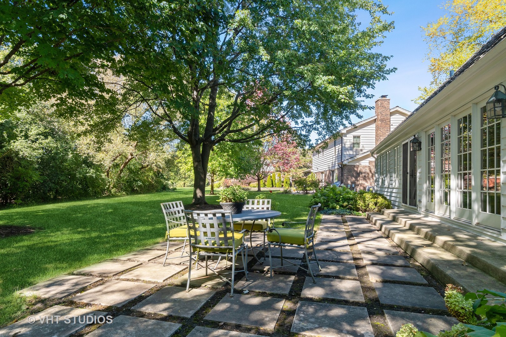540 Buena Road Lake Forest, IL 60045 - Photo 7 of 37 a view of a chair and table in backyard of the house