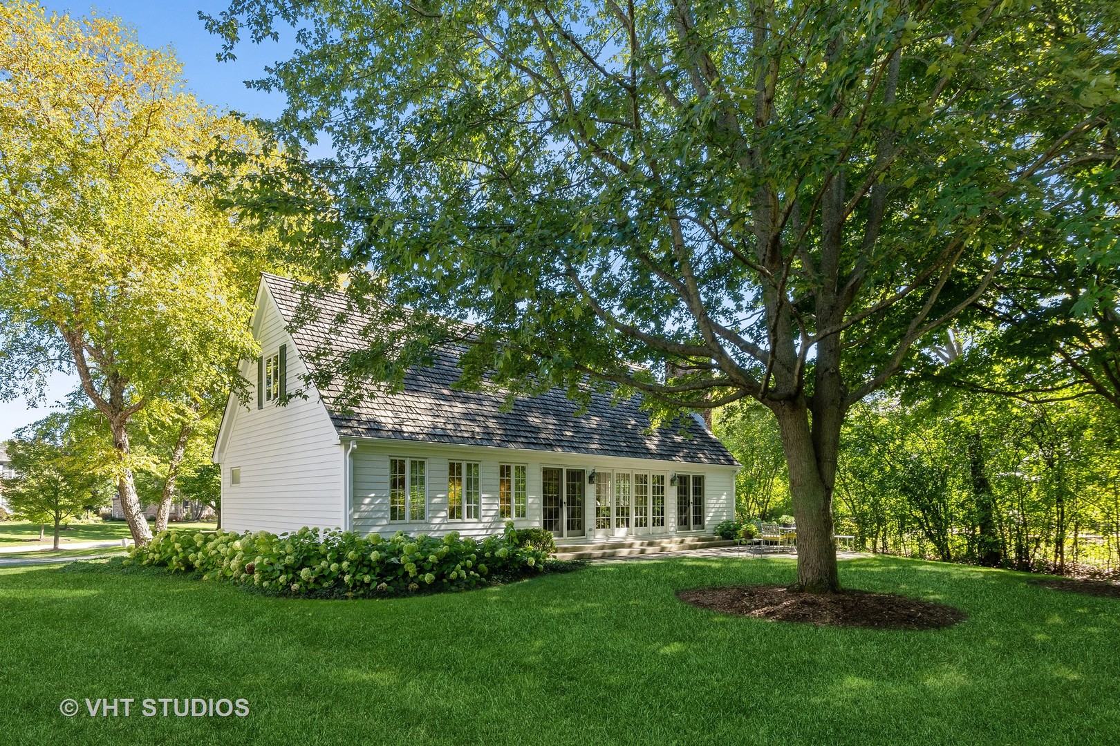540 Buena Road Lake Forest, IL 60045 - Photo 8 of 37 a front view of a house with a garden