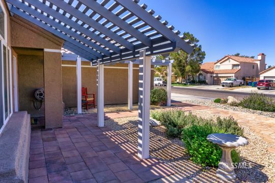 718 La Paloma Street Ridgecrest, CA 93555 - Photo 3 of 50 a view of a porch with furniture and floor to ceiling window