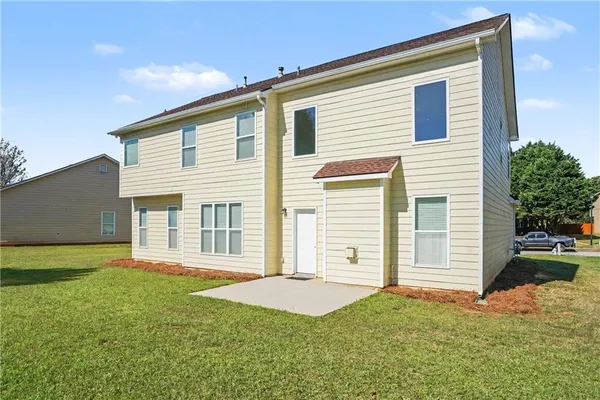 a front view of a house with a yard