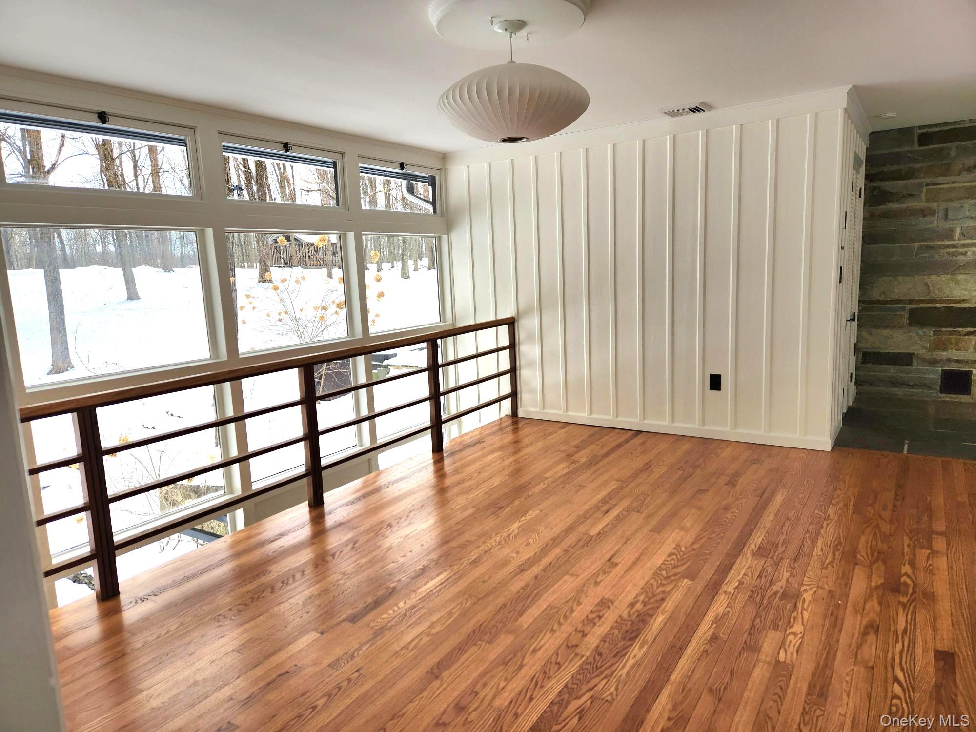 568 River Road Rhinebeck, NY 12572 - Photo 12 of 26 Spare room featuring wood finished floors and baseboards