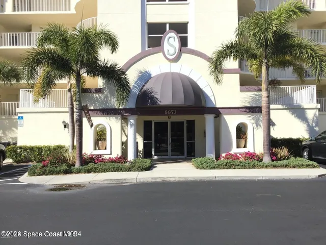 a front view of house with small garden