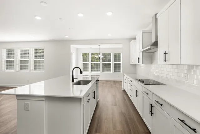 a room with a wooden floor and a window