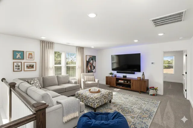 a bathroom with a double vanity sink a toilet and a mirror