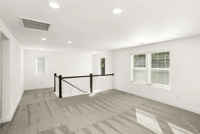 a bedroom with a bed and a desk