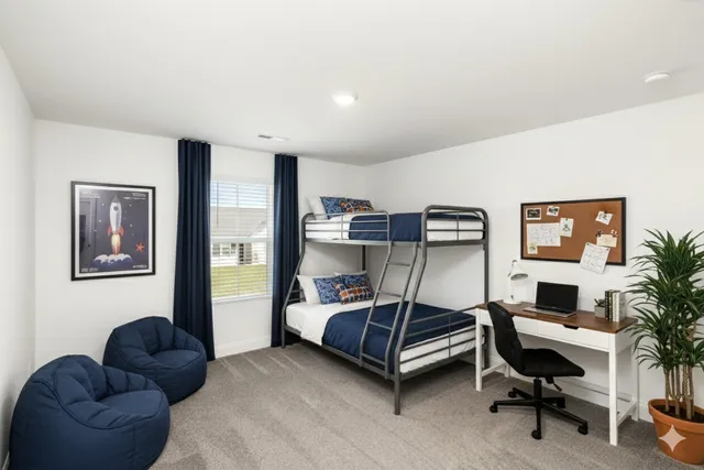 a bedroom with a large bed and a couch