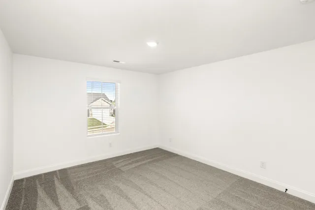 a bathroom with a double vanity sink mirror and next to a window