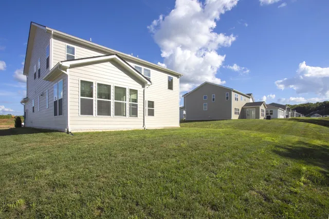 a view of a house with a big yard
