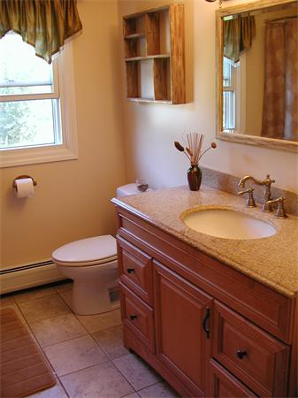 40 Long Plain Road Whately, MA 01373 - Photo 12 of 15 a bathroom with a granite countertop toilet sink and mirror