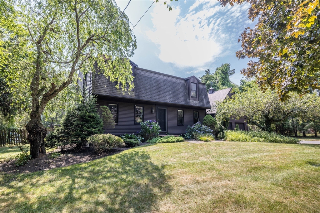 a view of a house with a yard