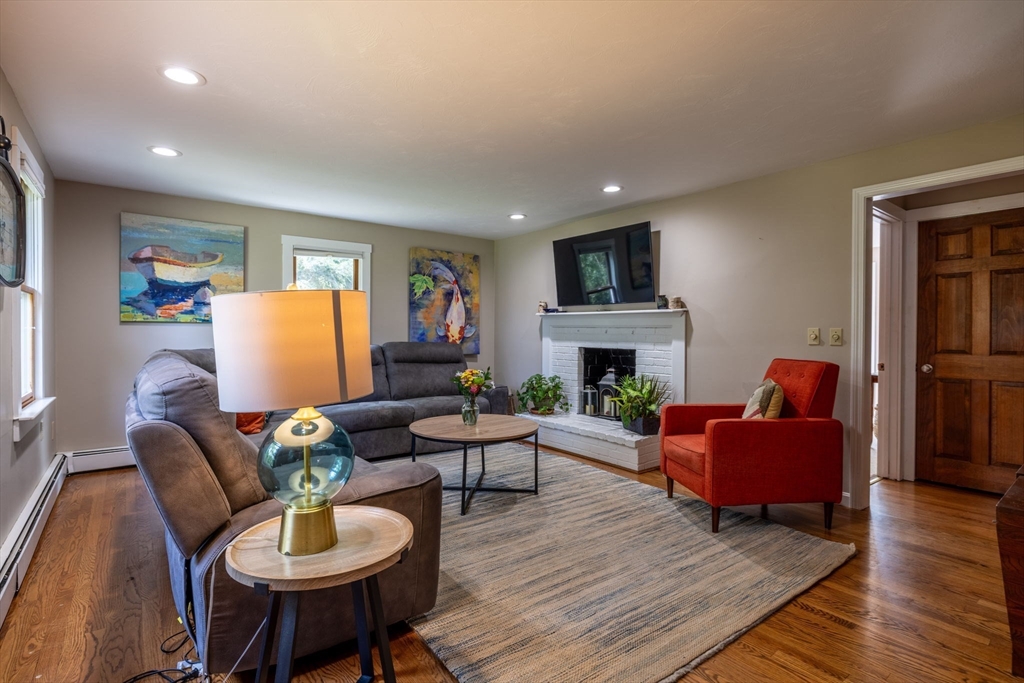 20 Staples Shore Road Lakeville, MA 02347 - Photo 13 of 39 a living room with furniture and a fireplace