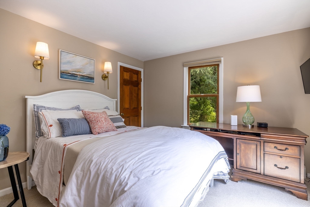 20 Staples Shore Road Lakeville, MA 02347 - Photo 15 of 39 a bedroom with a bed and a dresser