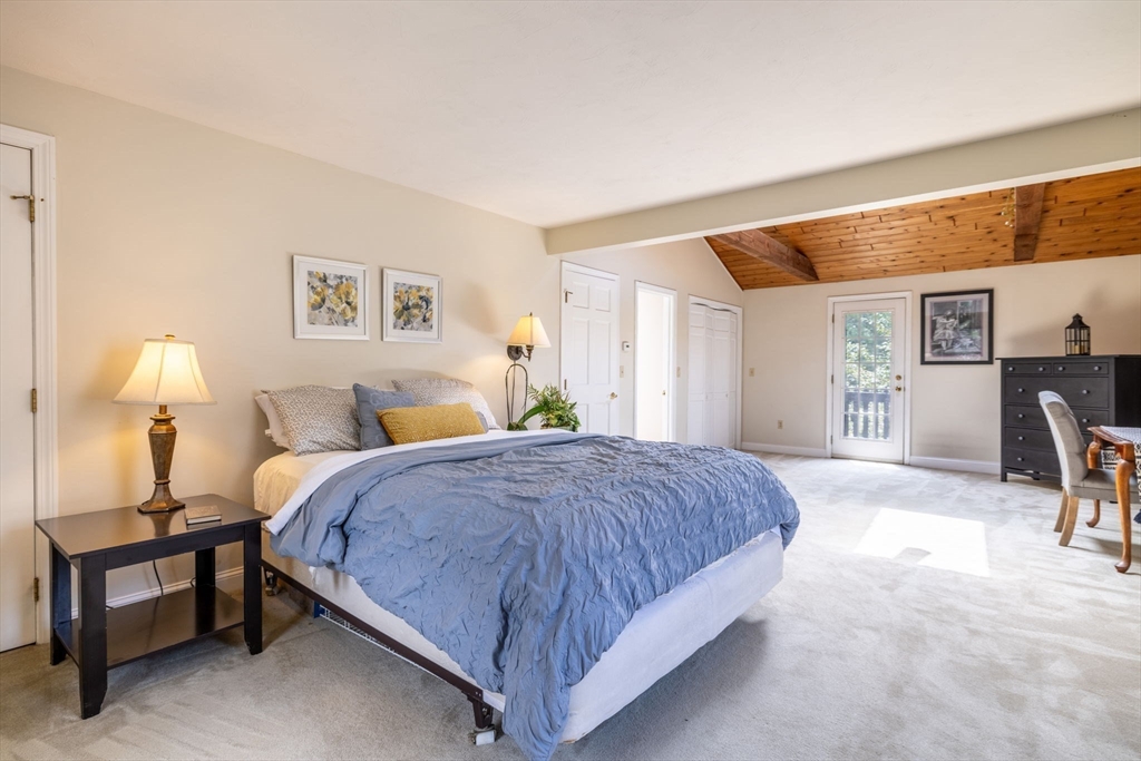 20 Staples Shore Road Lakeville, MA 02347 - Photo 16 of 39 a spacious bedroom with a bed and a table in it