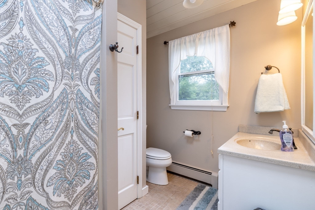 20 Staples Shore Road Lakeville, MA 02347 - Photo 19 of 39 a bathroom with a sink toilet and window