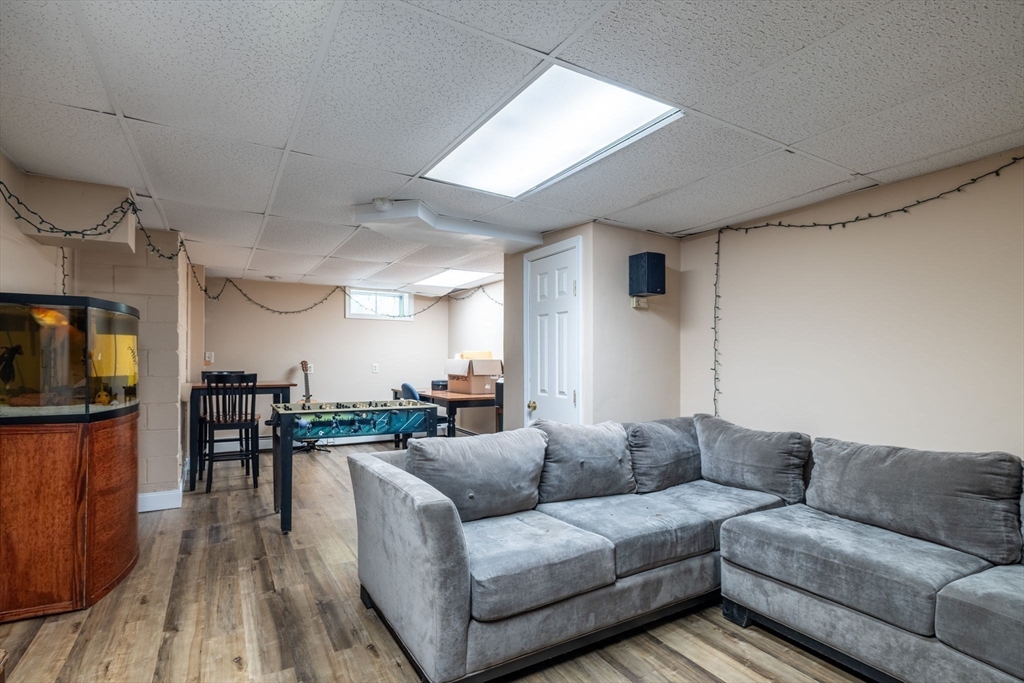 20 Staples Shore Road Lakeville, MA 02347 - Photo 26 of 39 a living room with furniture and a flat screen tv