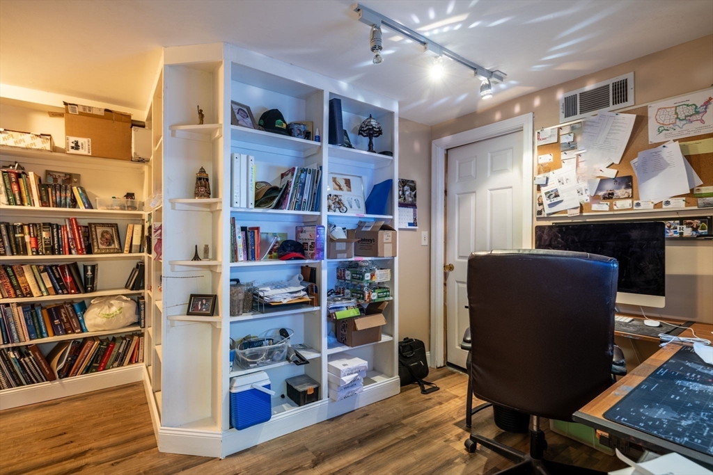 20 Staples Shore Road Lakeville, MA 02347 - Photo 28 of 39 a view of a workspace with furniture and a book shelf