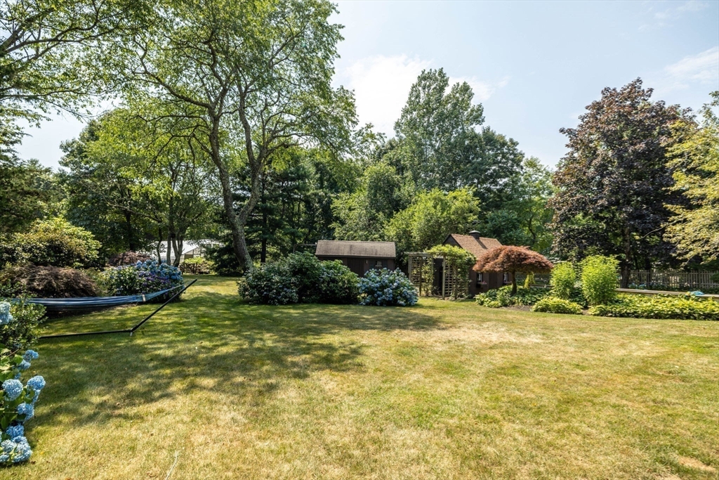 20 Staples Shore Road Lakeville, MA 02347 - Photo 29 of 39 a yellow house in middle of the forest