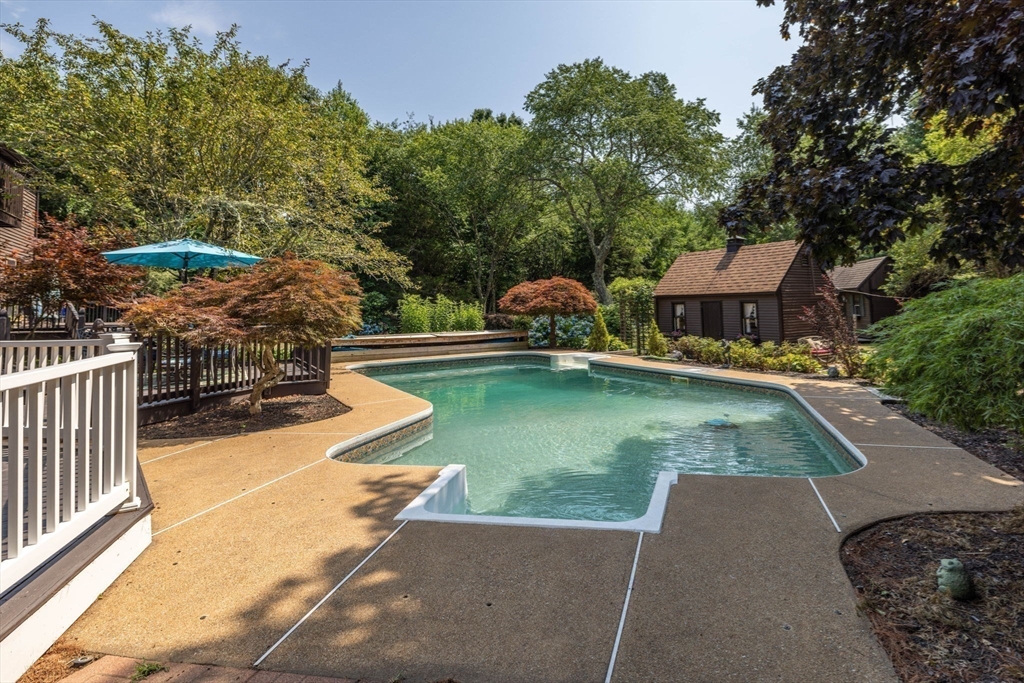 20 Staples Shore Road Lakeville, MA 02347 - Photo 33 of 39 swimming pool view with a seating space and a garden view