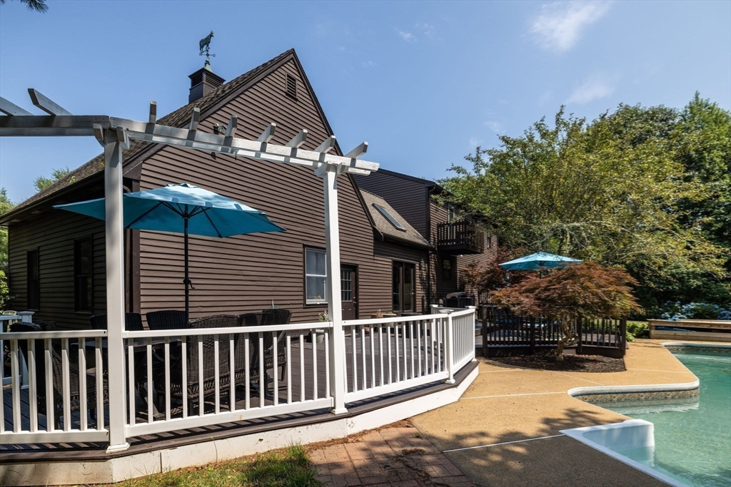 20 Staples Shore Road Lakeville, MA 02347 - Photo 34 of 39 a view of a house with a small yard and wooden fence