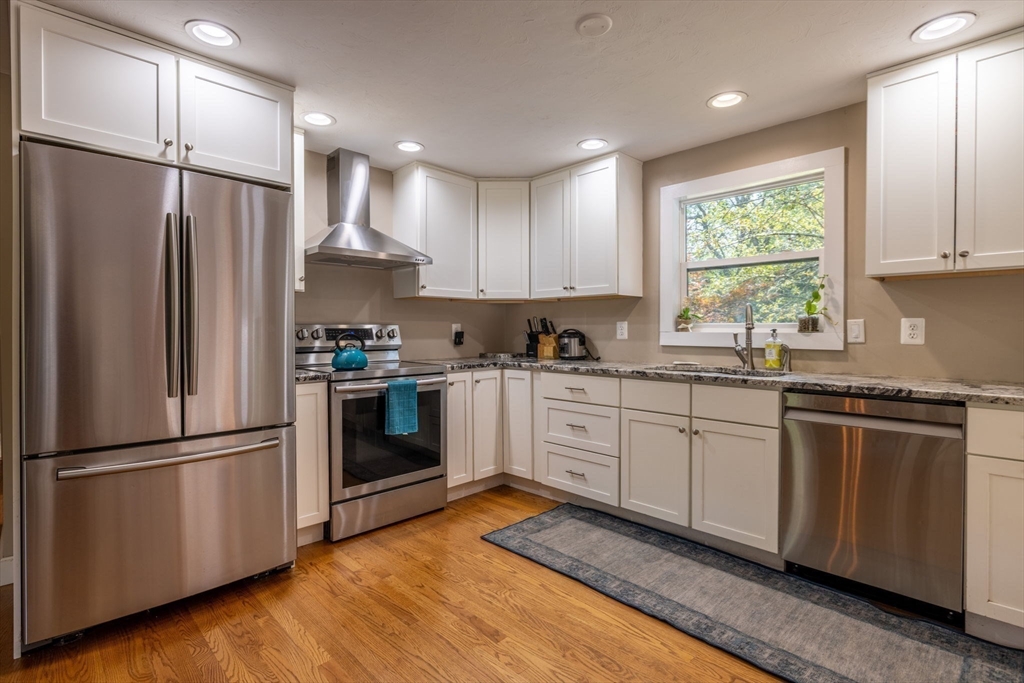 20 Staples Shore Road Lakeville, MA 02347 - Photo 6 of 39 a kitchen with stainless steel appliances granite countertop a refrigerator a stove a sink and a window