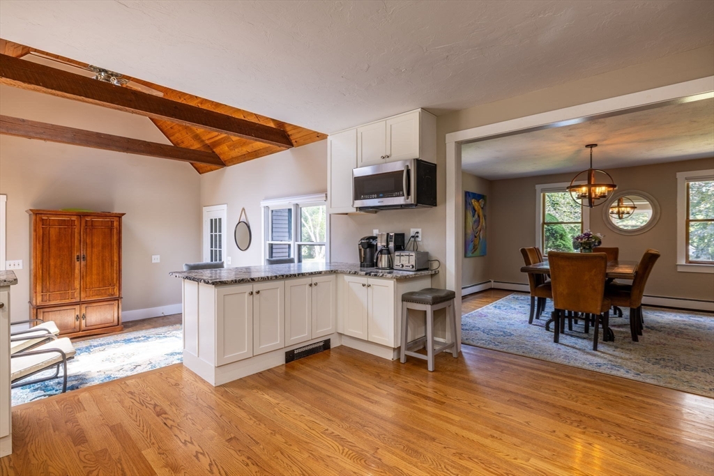 20 Staples Shore Road Lakeville, MA 02347 - Photo 8 of 39 a kitchen with a sink cabinets and dining table chair