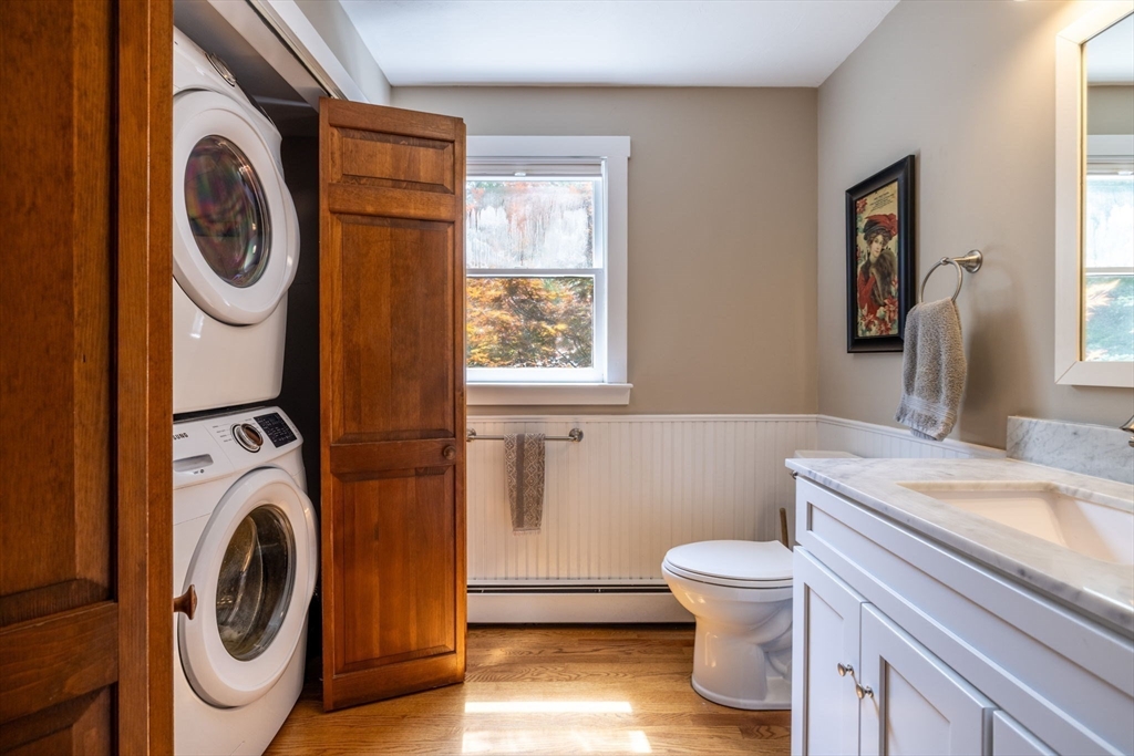 20 Staples Shore Road Lakeville, MA 02347 - Photo 10 of 39 a bathroom with a toilet a sink and a mirror