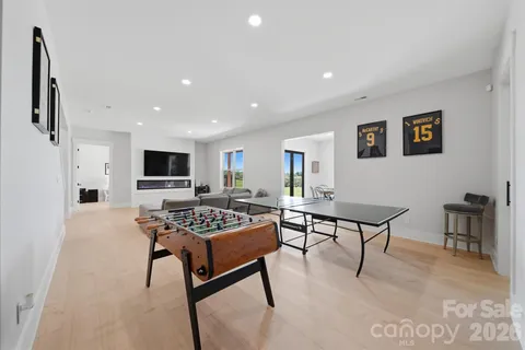 a dining room with stainless steel appliances a table and chairs