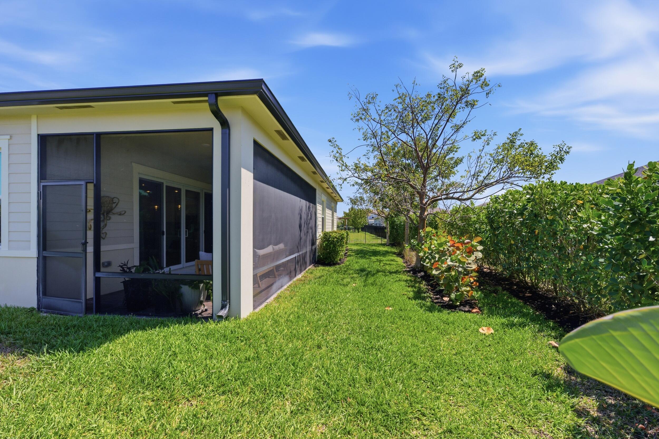 19230 Rolling Acres Road Loxahatchee, FL 33470 - Photo 42 of 58 a view of a house with a backyard