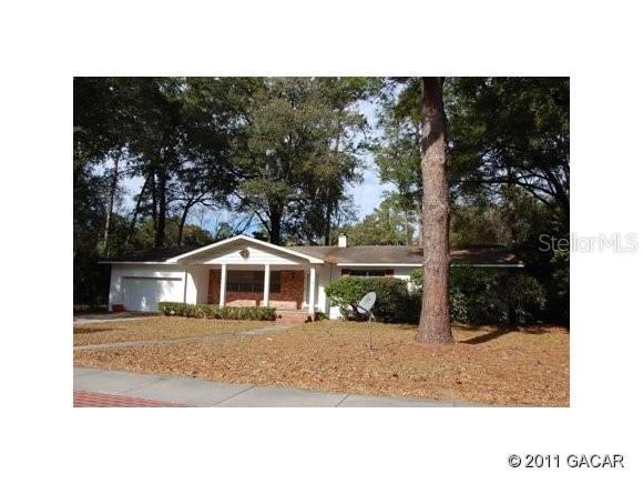 3106 West University Avenue Gainesville, FL 32607 - Photo 1 of 1 a black and white photo of a house