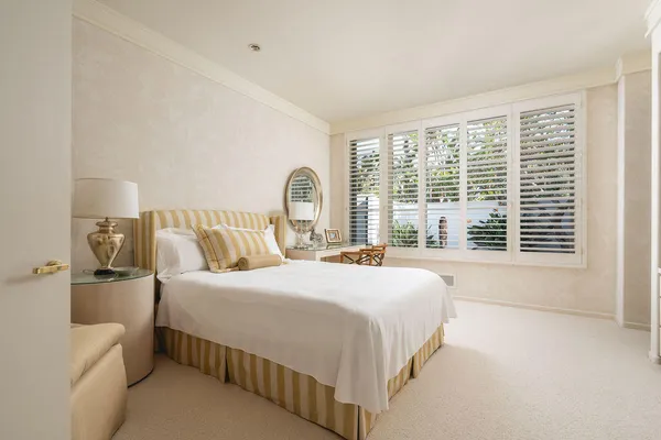 a bathroom with a double vanity sink and mirror