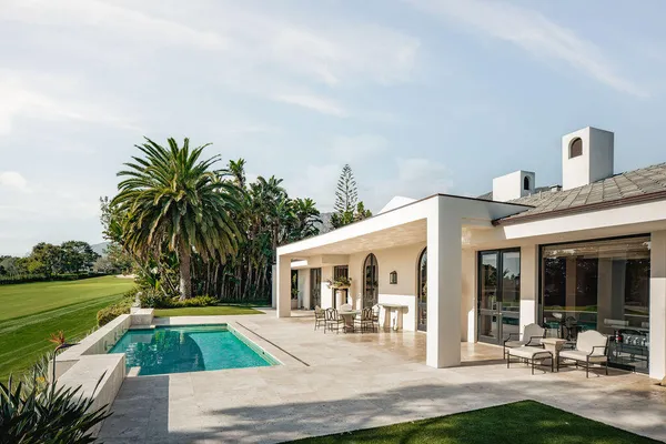 a front view of house with yard and green space