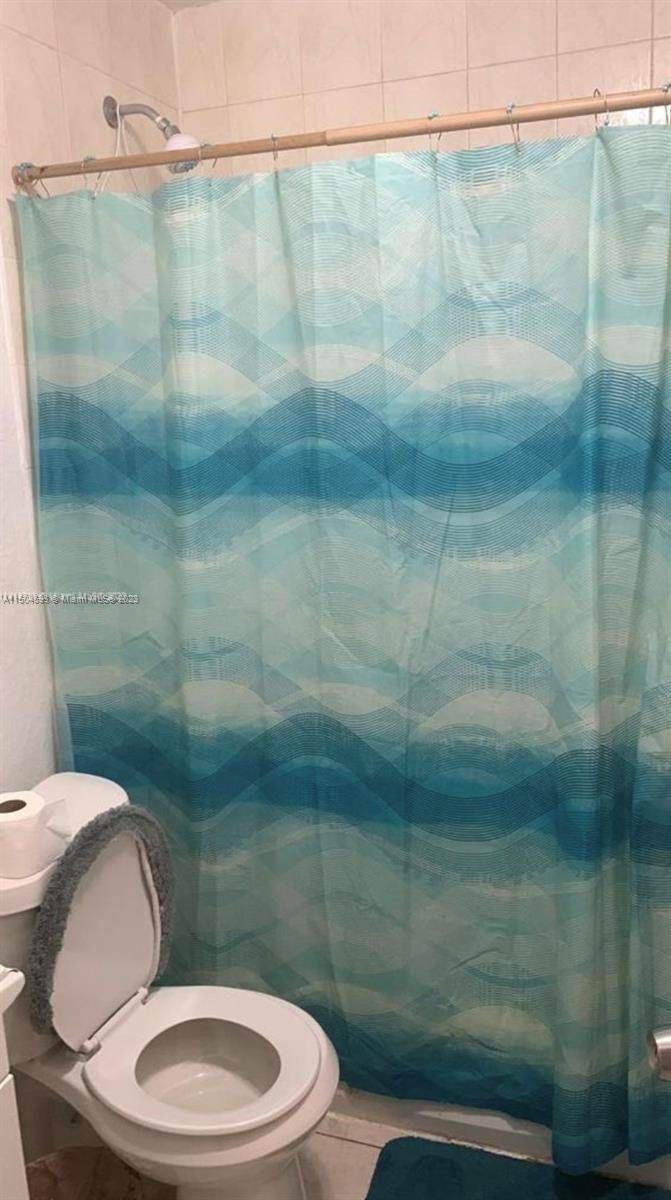 Gladeview Miami, FL 33147 - Photo 8 of 10 a bathroom with a toilet and a shower