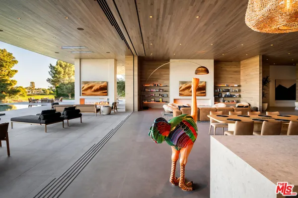 a living room with furniture and lamp