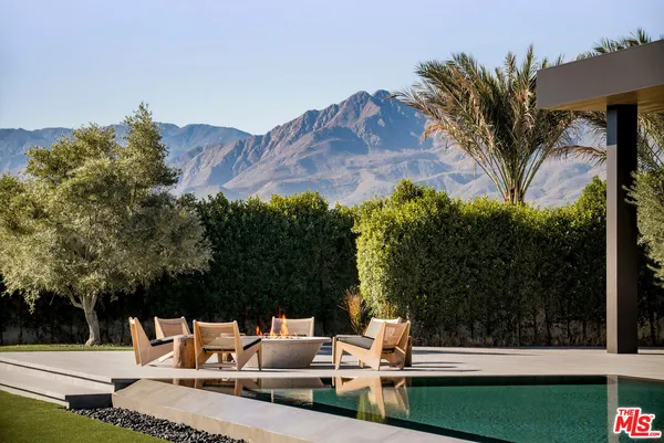 a bedroom with furniture and a fireplace