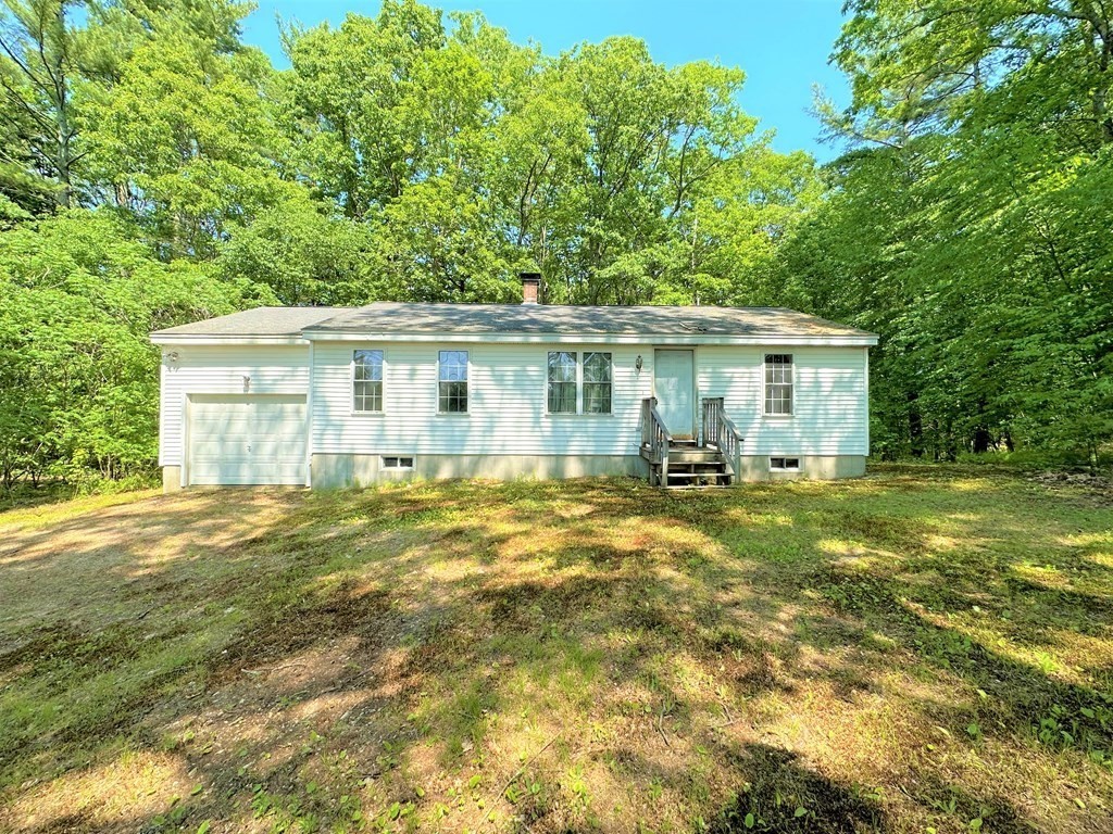 380 Cutler Road Barre, MA 01005 - Photo 1 of 13 a view of a house with backyard and sitting area