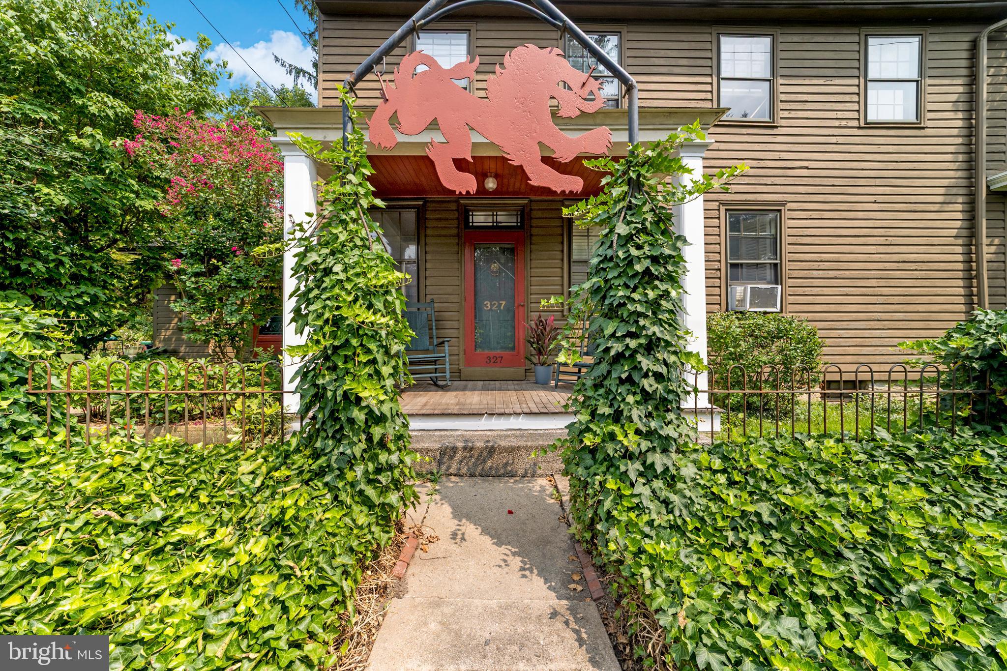 327 East Street Road Kennett Square, PA 19348 - Photo 2 of 43 a view of a house with a flower garden