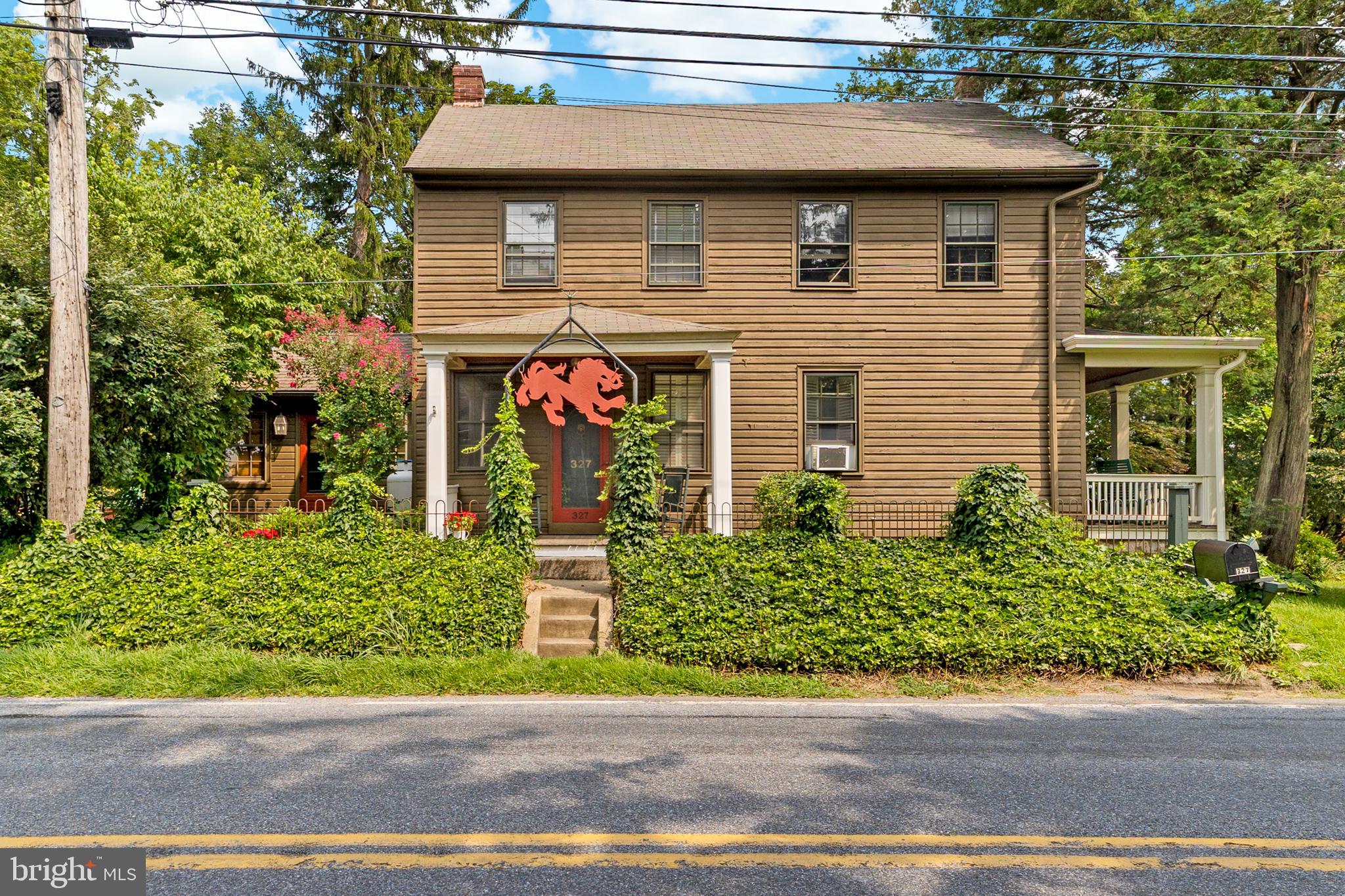 327 East Street Road Kennett Square, PA 19348 - Photo 3 of 43 a front view of a house with a yard