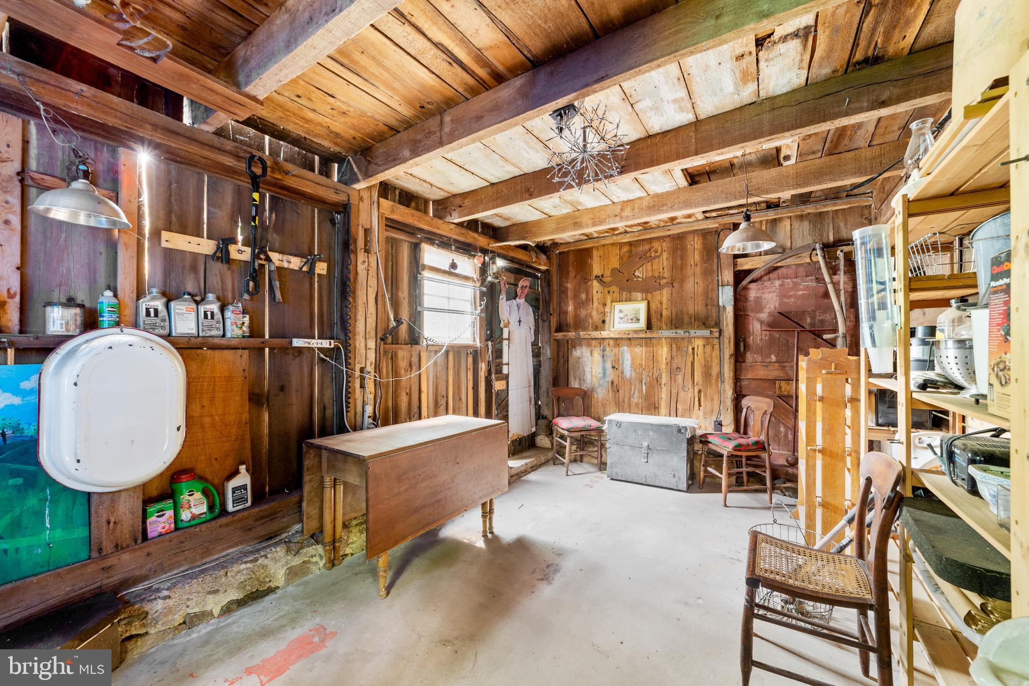 327 East Street Road Kennett Square, PA 19348 - Photo 39 of 43 a living room with furniture a window and a chandelier