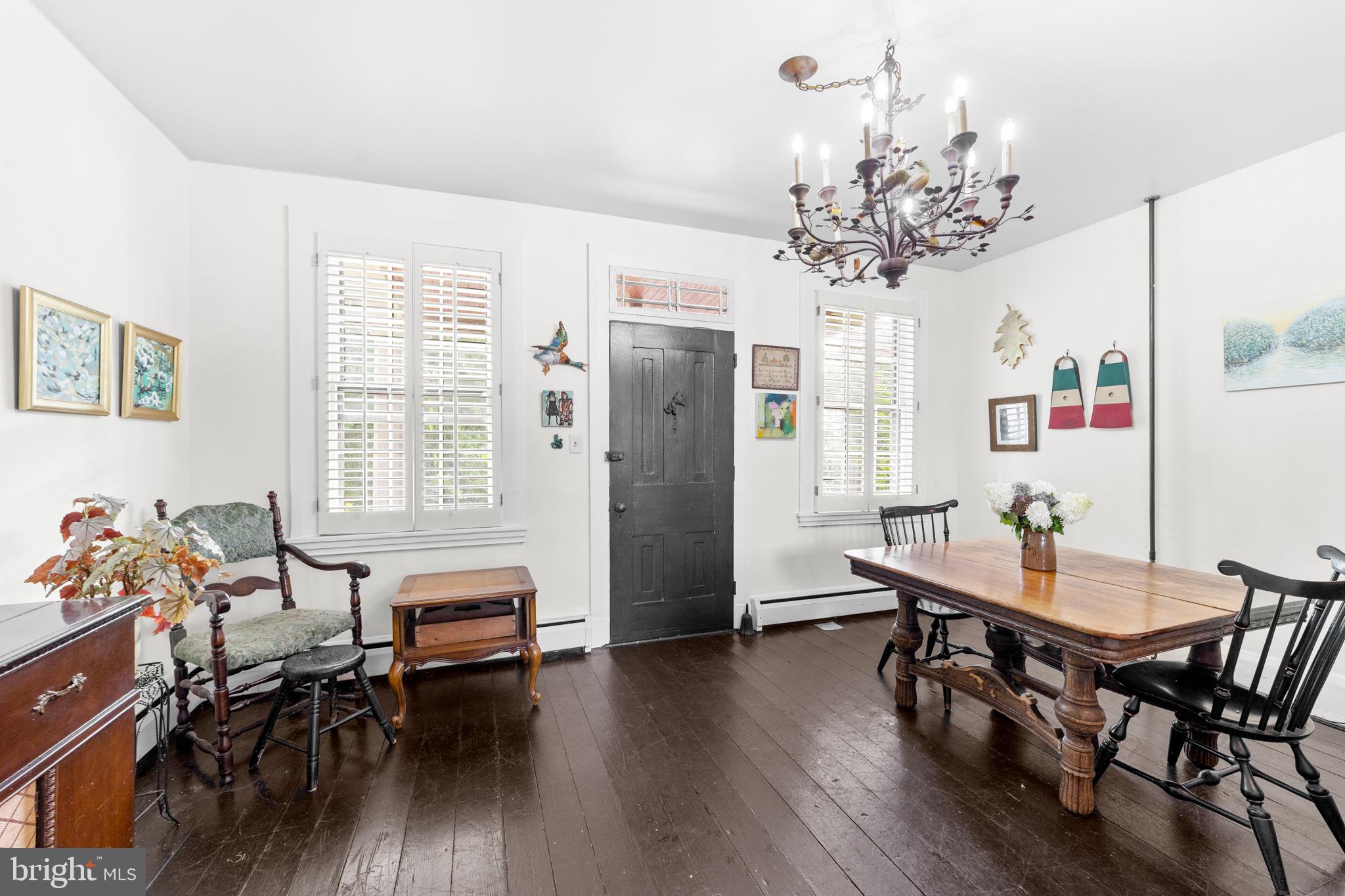 327 East Street Road Kennett Square, PA 19348 - Photo 8 of 43 a view of a dining room with furniture wooden floor and chandelier