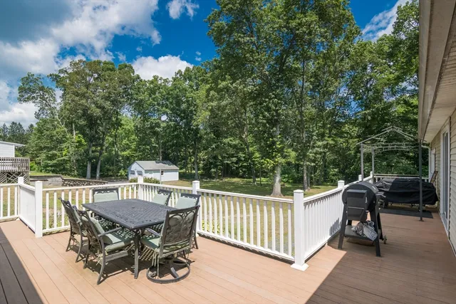 a view of a patio with a table and chairs