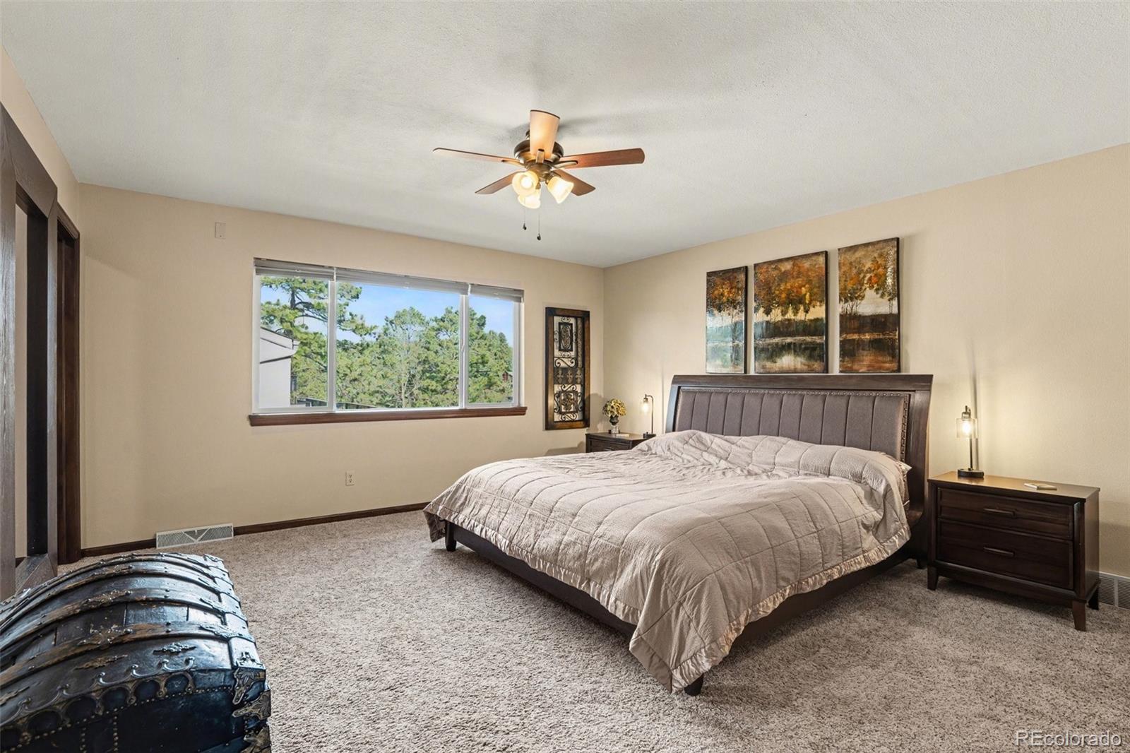 6224 Powell Road Parker, CO 80134 - Photo 11 of 40 a bedroom with a bed and window