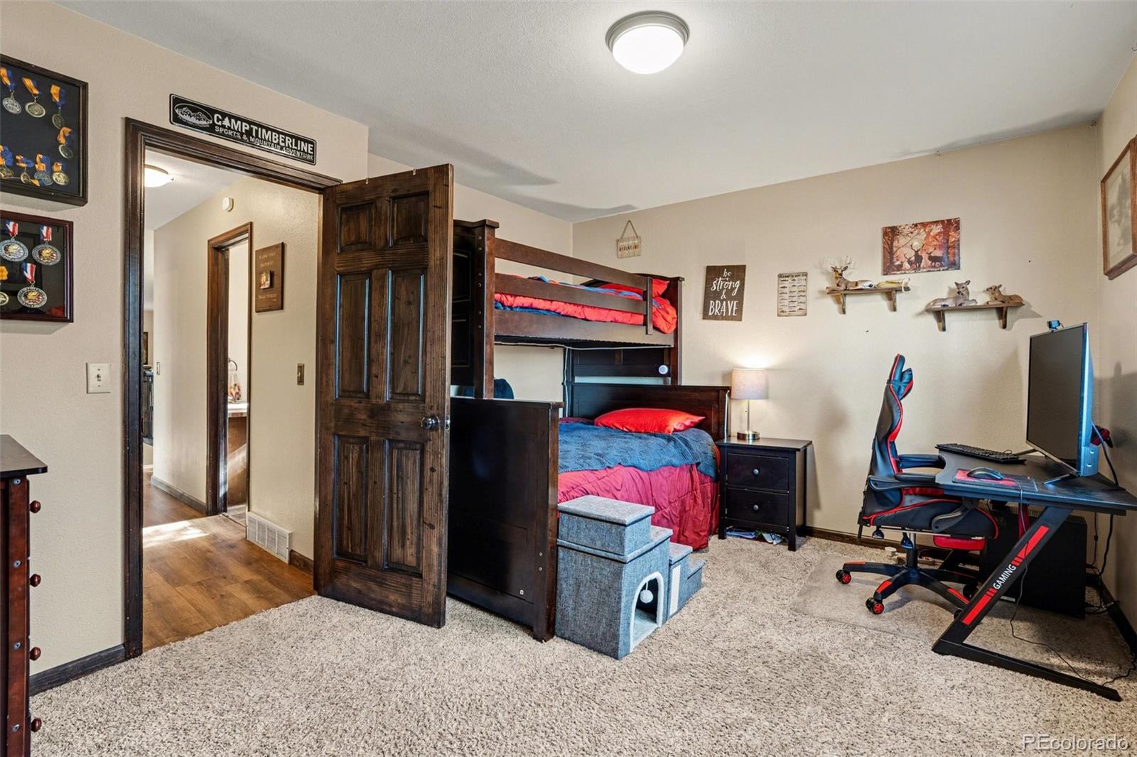 6224 Powell Road Parker, CO 80134 - Photo 15 of 40 a living room with furniture and a flat screen tv